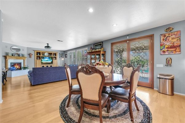 Dining room, Fireplace, Interior, Living room, Recessed Lighting, Wood Texture Flooring