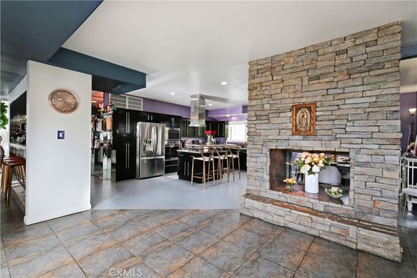Fireplace, Interior, Kitchen, Recessed Lighting, Stainless Steel Appliances, Stone Walls