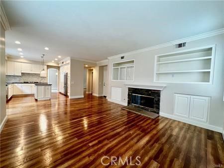 Empty room, Fireplace, Interior, Kitchen, Pendant Lights, Recessed Lighting, Wood Texture Flooring