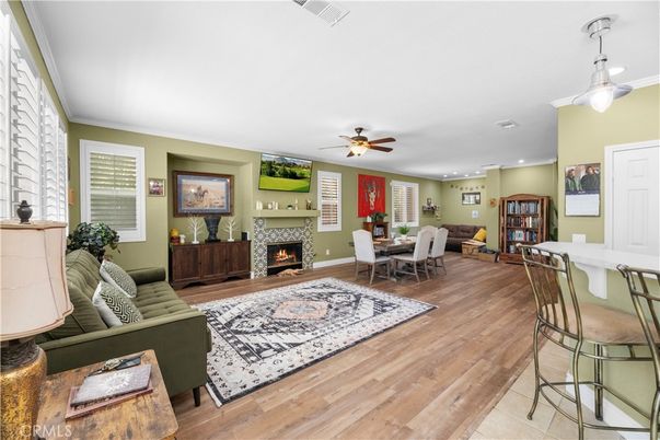 Dining room, Fireplace, Interior, Living room, Recessed Lighting, Wood Texture Flooring