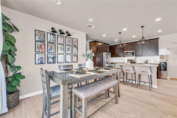 Dining room, Interior, Kitchen, Pendant Lights, Recessed Lighting, Stainless Steel Appliances, Wood Texture Flooring