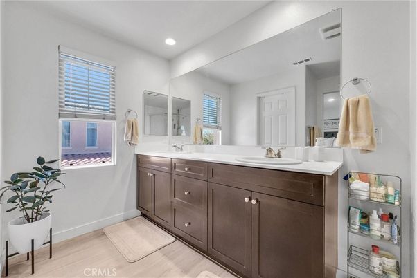 Bathroom, Dual Sink Vanities, Interior, Recessed Lighting, Wood Texture Flooring