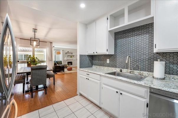 Dining room, Interior, Kitchen, Living room, Pendant Lights, Recessed Lighting, Stainless Steel Appliances, Wood Texture Flooring