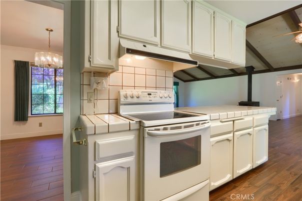 Chandelier, Interior, Kitchen, Tile Countertops, Wood Texture Flooring