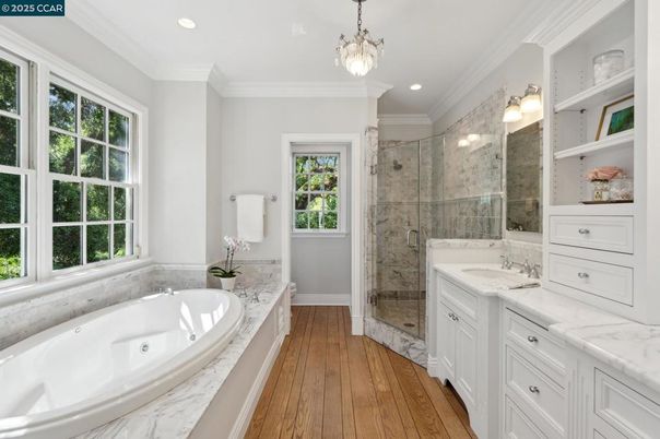 Bathroom, Dual Sink Vanities, Glass Shower, Interior, Pendant Lights, Recessed Lighting, Wood Texture Flooring