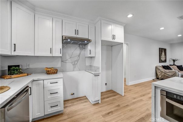 Interior, Kitchen, Marble Walls, Recessed Lighting, Stainless Steel Appliances, Wood Texture Flooring