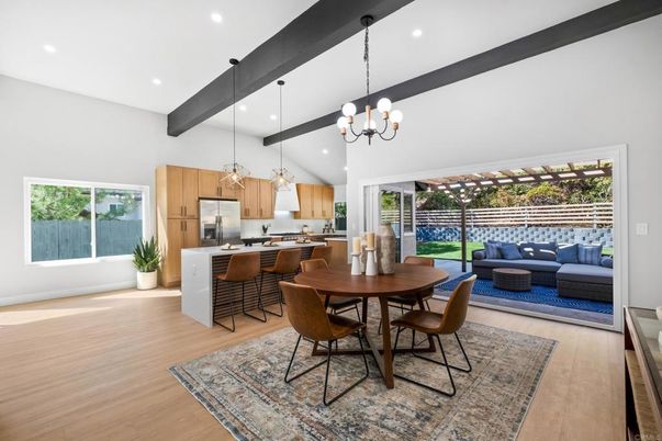 Chandelier, Dining room, Interior, Kitchen, Living room, Pendant Lights, Recessed Lighting, Stainless Steel Appliances, Wooden Beams, Wood Texture Flooring