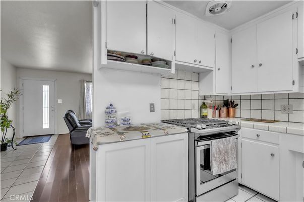 Interior, Kitchen, Stainless Steel Appliances, Tile Countertops, Wood Texture Flooring