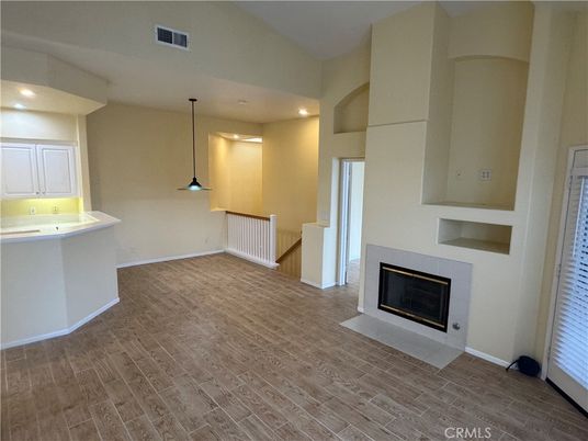 Fireplace, Interior, Pendant Lights, Recessed Lighting, Wood Texture Flooring