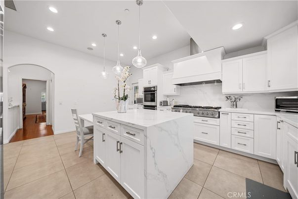 Dining room, Interior, Kitchen, Marble Walls, Pendant Lights, Recessed Lighting, Stainless Steel Appliances, Wood Texture Flooring