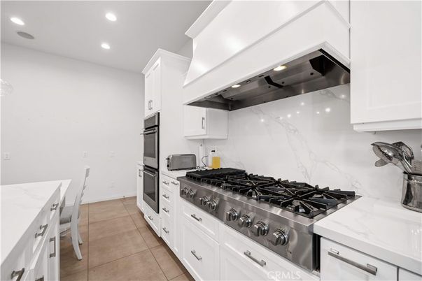 Interior, Kitchen, Marble Walls, Recessed Lighting, Stainless Steel Appliances