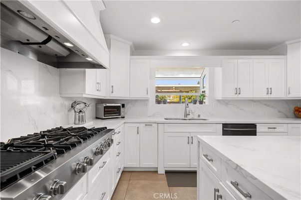 Interior, Kitchen, Marble Walls, Recessed Lighting, Stainless Steel Appliances