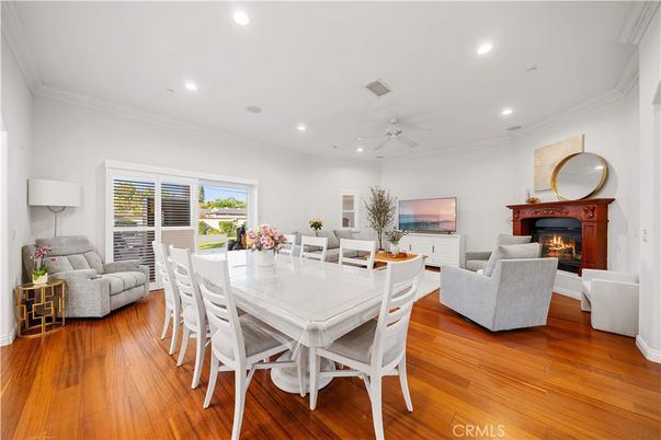 Dining room, Fireplace, Interior, Living room, Recessed Lighting, Wood Texture Flooring