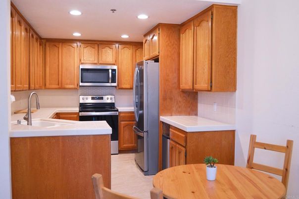 Interior, Kitchen, Recessed Lighting, Stainless Steel Appliances, Tile Countertops