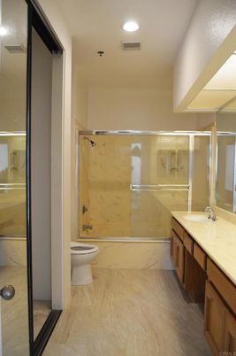 Bathroom, Dual Sink Vanities, Glass Shower, Interior, Marble, Marble Walls, Recessed Lighting