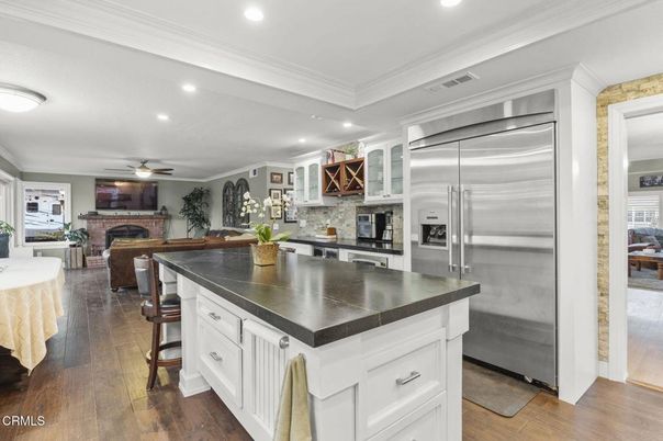 Fireplace, Interior, Kitchen, Recessed Lighting, Stainless Steel Appliances, Wood Texture Flooring