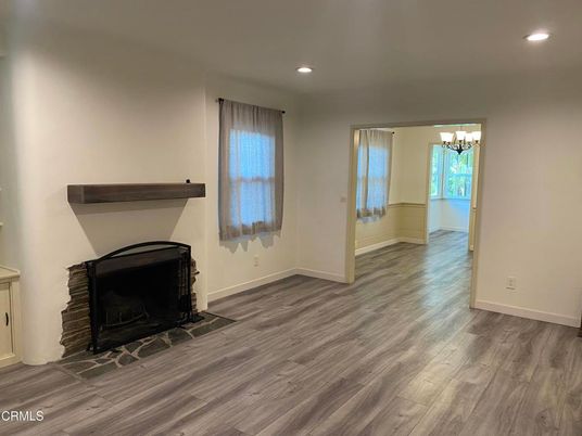 Chandelier, Empty room, Fireplace, Interior, Recessed Lighting, Wood Texture Flooring