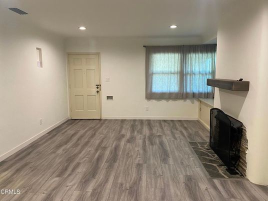Empty room, Fireplace, Interior, Recessed Lighting, Wood Texture Flooring