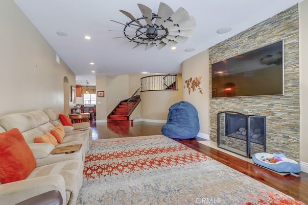 Fireplace, Interior, Living room, Recessed Lighting, Stone Walls, Wood Texture Flooring