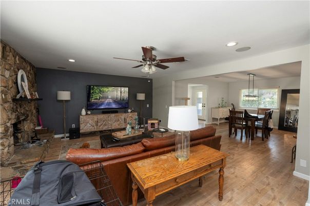 Dining room, Fireplace, Interior, Living room, Pendant Lights, Recessed Lighting, Stone Walls, Wood Texture Flooring