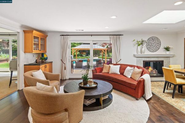 Dining room, Fireplace, Interior, Living room, Recessed Lighting, Wood Texture Flooring