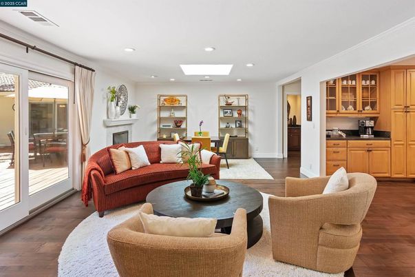 Dining room, Fireplace, Interior, Living room, Recessed Lighting, Wood Texture Flooring