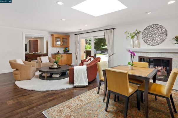 Dining room, Fireplace, Interior, Living room, Recessed Lighting, Wood Texture Flooring
