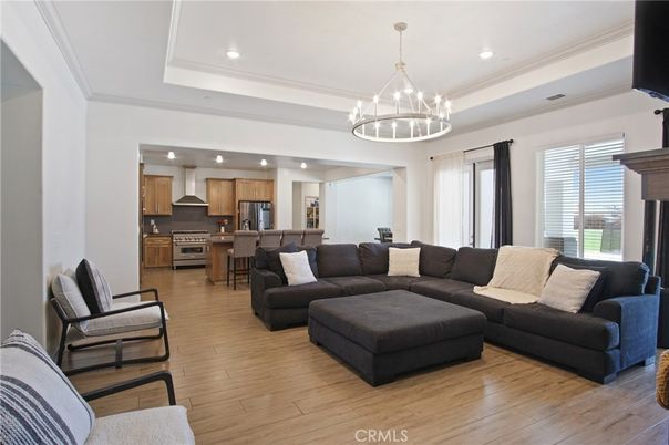 Chandelier, Interior, Kitchen, Living room, Pendant Lights, Recessed Lighting, Stainless Steel Appliances, Wood Texture Flooring