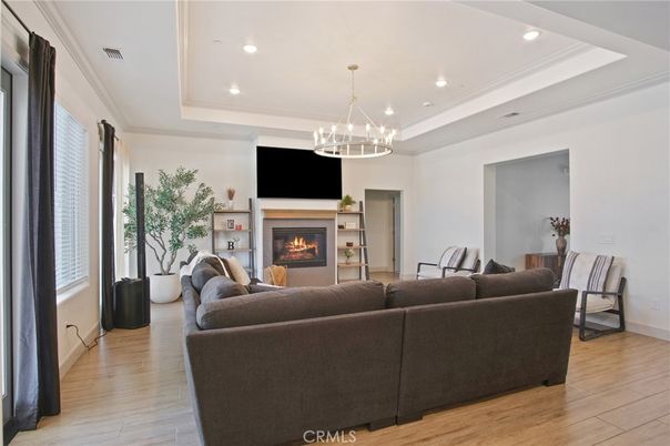 Chandelier, Fireplace, Interior, Living room, Pendant Lights, Recessed Lighting, Wood Texture Flooring