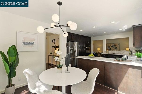 Dining room, Interior, Kitchen, Pendant Lights, Recessed Lighting, Stainless Steel Appliances, Wood Texture Flooring