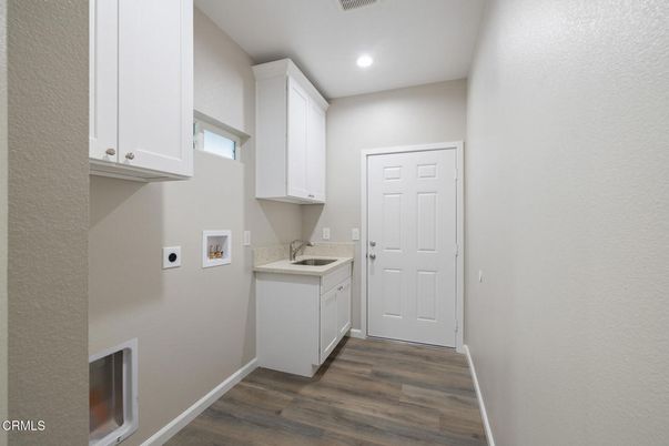 Interior, Kitchen, Recessed Lighting, Washer, Wood Texture Flooring