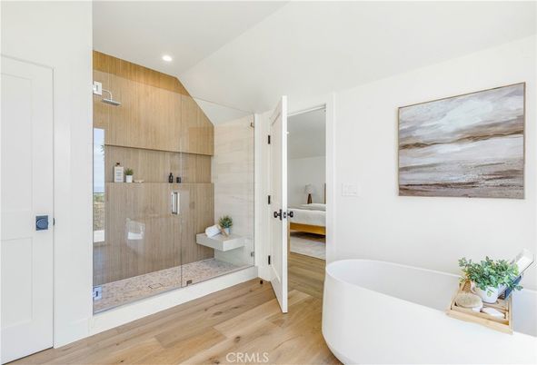 Bathroom, Free Standing Baths, Glass Shower, Interior, Recessed Lighting, Wood Texture Flooring