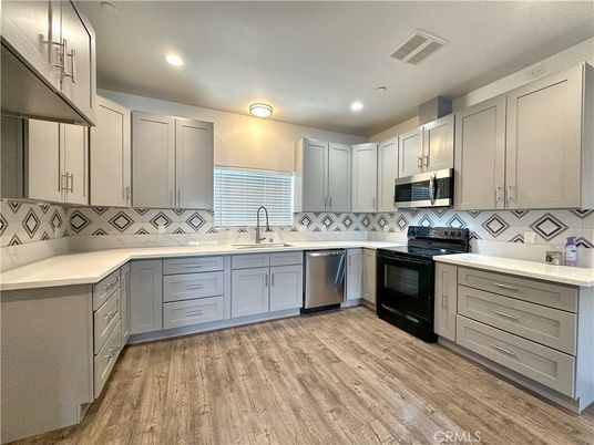 Interior, Kitchen, Recessed Lighting, Stainless Steel Appliances, Wood Texture Flooring