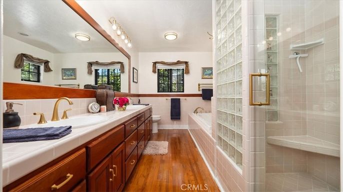 Bathroom, Dual Sink Vanities, Glass Shower, Interior, Tile Countertops, Wood Texture Flooring