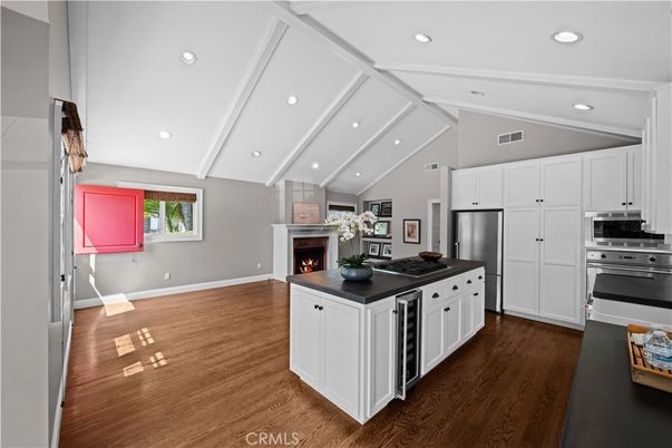 Fireplace, Interior, Kitchen, Recessed Lighting, Stainless Steel Appliances, Wood Texture Flooring