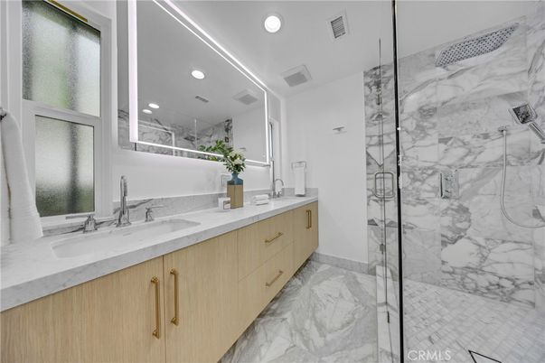 Bathroom, Dual Sink Vanities, Glass Shower, Interior, Marble, Marble Walls, Recessed Lighting