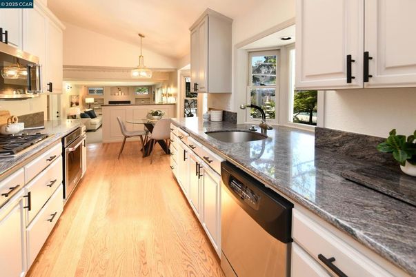 Dining room, Interior, Kitchen, Pendant Lights, Stainless Steel Appliances, Wood Texture Flooring