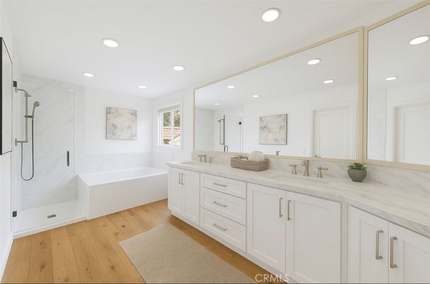 Bathroom, Dual Sink Vanities, Interior, Marble Walls, Recessed Lighting, Wood Texture Flooring