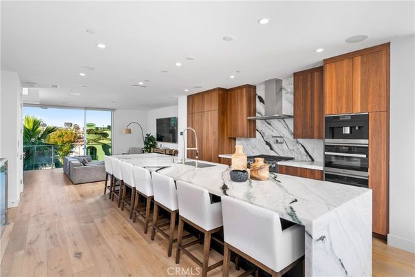 Interior, Kitchen, Marble Walls, Recessed Lighting, Stainless Steel Appliances, Wood Texture Flooring