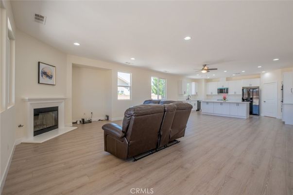 Fireplace, Interior, Kitchen, Living room, Recessed Lighting, Stainless Steel Appliances, Wood Texture Flooring