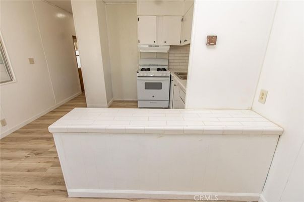 Interior, Kitchen, Tile Countertops, Wood Texture Flooring