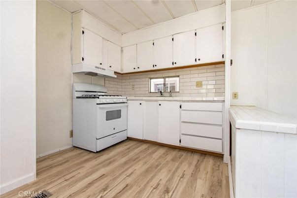 Interior, Kitchen, Tile Countertops, Wood Texture Flooring