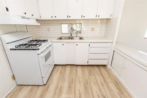 Interior, Kitchen, Tile Countertops, Wood Texture Flooring