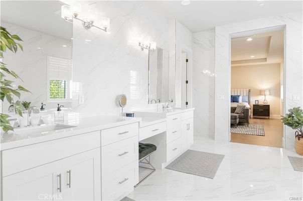 Bathroom, Bedroom, Dual Sink Vanities, Interior, Marble, Marble Walls, Recessed Lighting, Wood Texture Flooring