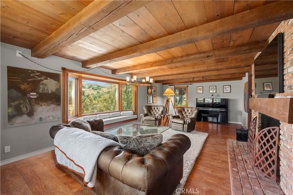 Chandelier, Fireplace, Interior, Living room, Piano, Wooden Beams, Wooden Ceilings, Wood Texture Flooring