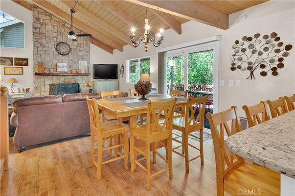 Chandelier, Dining room, Fireplace, Interior, Living room, Stone Walls, Wooden Beams, Wooden Ceilings, Wood Texture Flooring