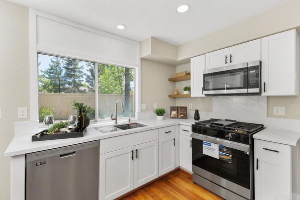 Interior, Kitchen, Recessed Lighting, Stainless Steel Appliances, Wood Texture Flooring