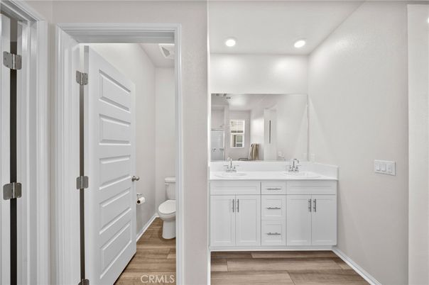 Bathroom, Dual Sink Vanities, Interior, Recessed Lighting, Wood Texture Flooring