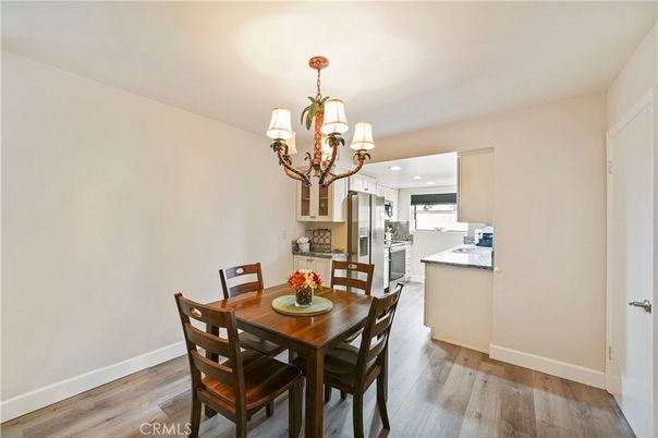 Chandelier, Dining room, Interior, Kitchen, Recessed Lighting, Stainless Steel Appliances, Wood Texture Flooring