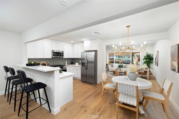 Dining room, Interior, Kitchen, Pendant Lights, Recessed Lighting, Stainless Steel Appliances, Wood Texture Flooring
